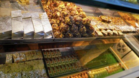 Assorted Bengali sweets including rosogolla and sandesh on display at a traditional Kolkata sweet shop