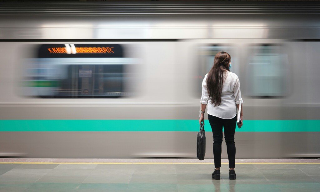Metro train pulling into a platform, illustrating rising Kolkata Metro ridership and network expansion