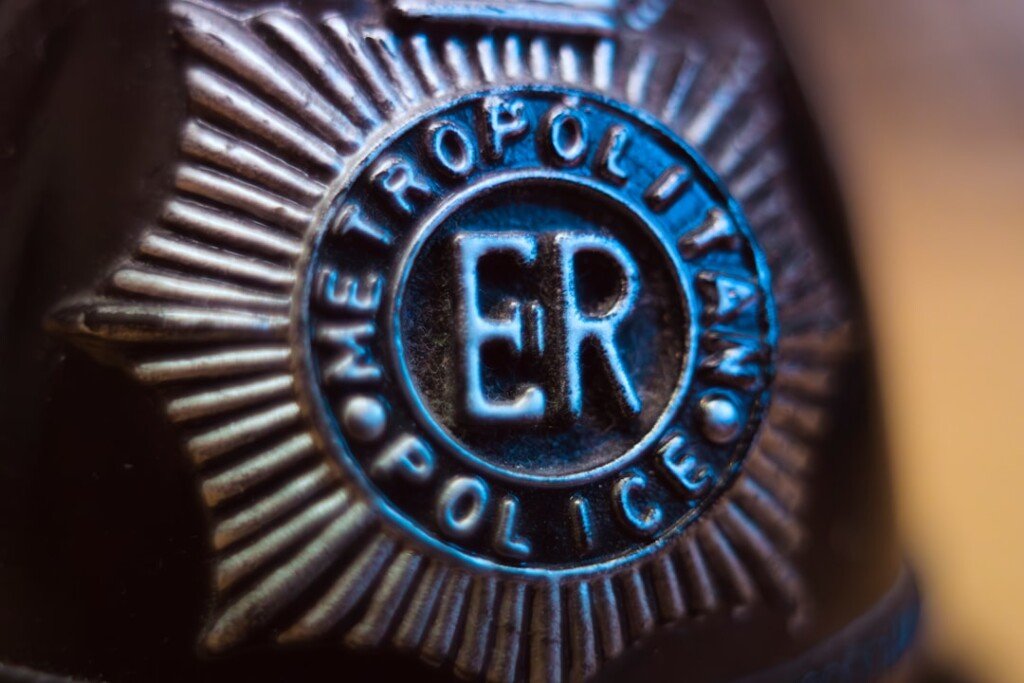 Close-up of a police badge, representing law enforcement and security agencies, generic security imagery for the STF ISI arrest report