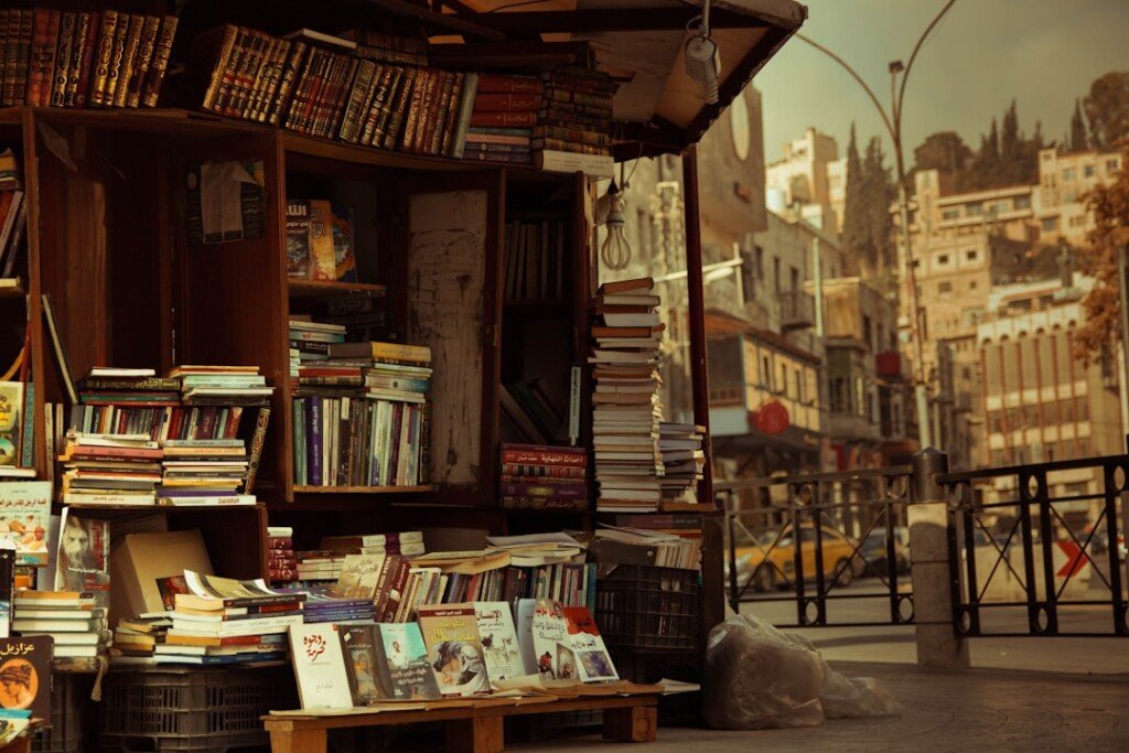 Stacks of secondhand books at a pavement bookstall, similar to stalls at Kolkata's College Street book market