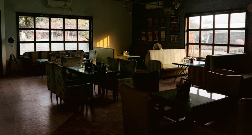 Old-style cafe interior with wooden tables, evoking Kolkata's historic Indian Coffee House on College Street