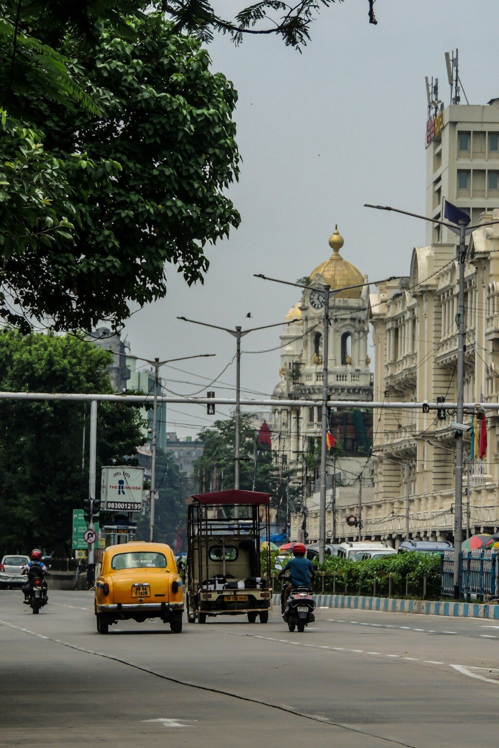 Busy Kolkata residential street representing PG accommodation areas like Behala and Bhowanipore