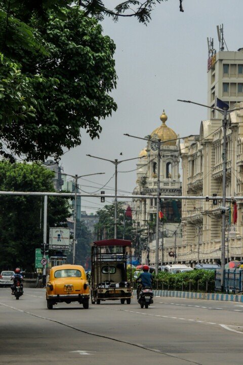 Busy Kolkata residential street representing PG accommodation areas like Behala and Bhowanipore