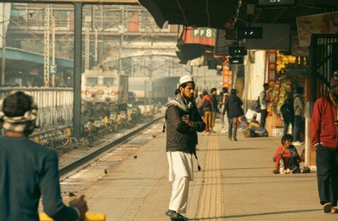 Commuters waiting on a crowded Kolkata Suburban Railway platform