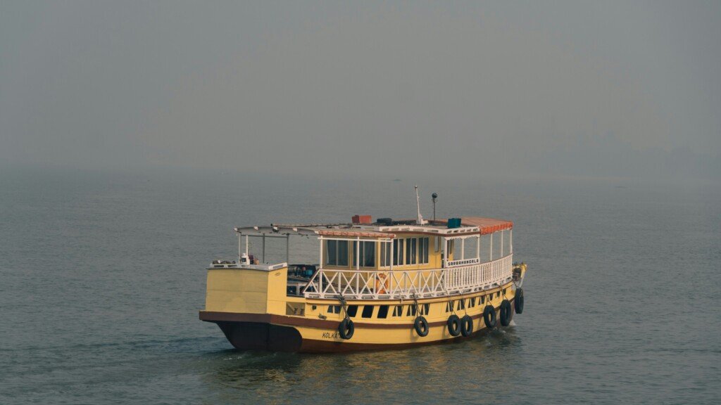 A passenger ferry crossing the Hooghly river in West Bengal, a common way to reach day trip destinations near Kolkata