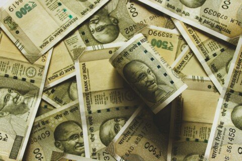 Indian rupee banknotes laid out, representing the monthly cost of living in Kolkata for students