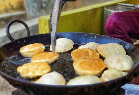 Freshly fried kochuri, the classic deep-fried breakfast bread eaten across Kolkata in the early morning