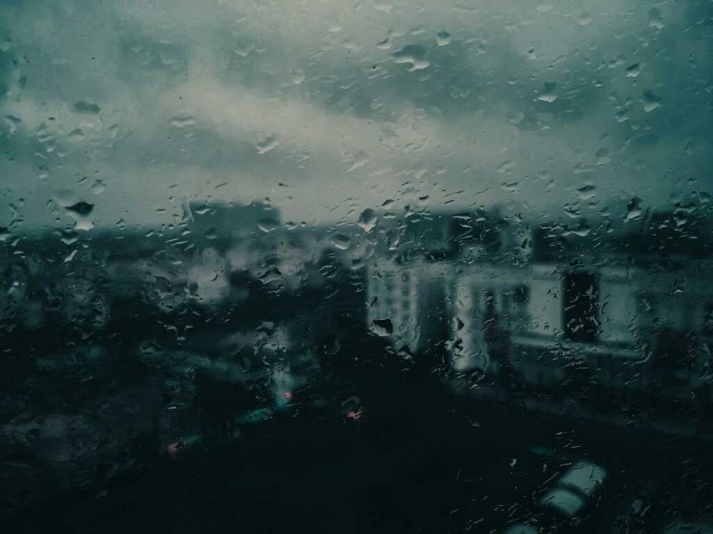 Raindrops on a window during monsoon rain in Kolkata