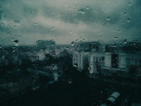 Raindrops on a window during monsoon rain in Kolkata