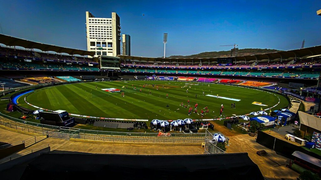 Crowd in the stands of a large cricket stadium on match day