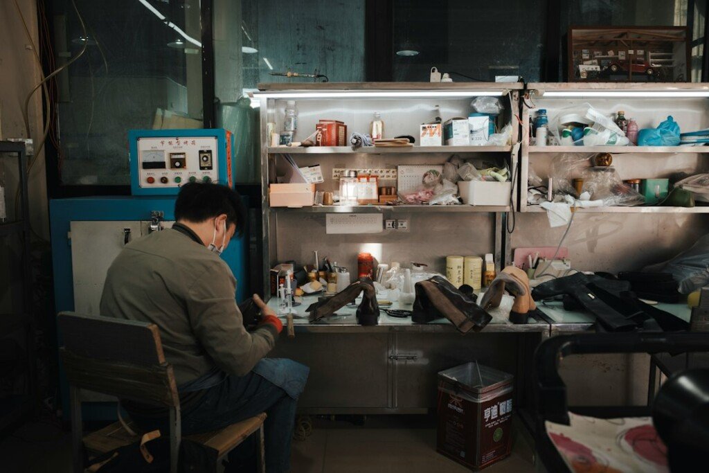 Corner of a handcrafted leather shoe workshop with shoes and tools, representing handmade leather shoes in Kolkata