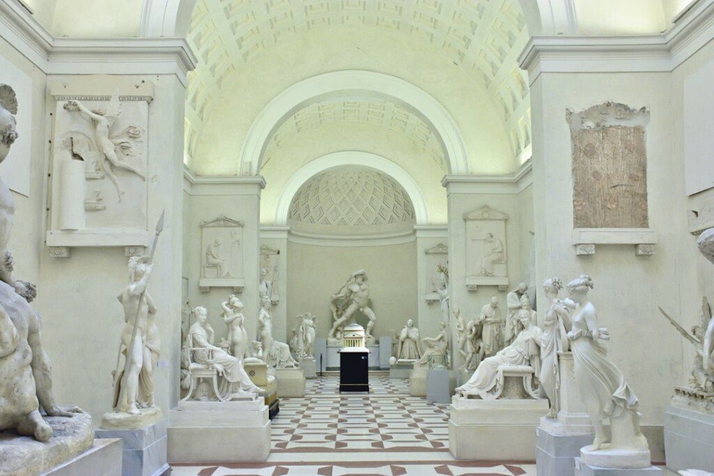 Museum gallery with ancient stone sculptures on display, representing the archaeology collections of the Indian Museum Kolkata