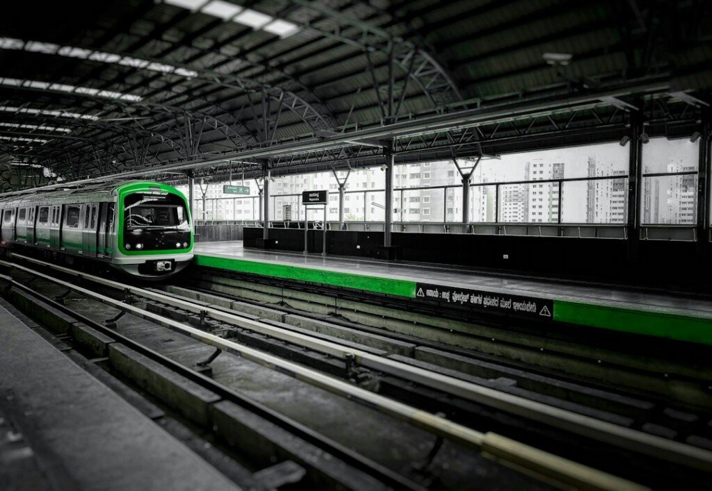 Metro train arriving at an urban station platform, illustrating a metro ticket and smart card guide