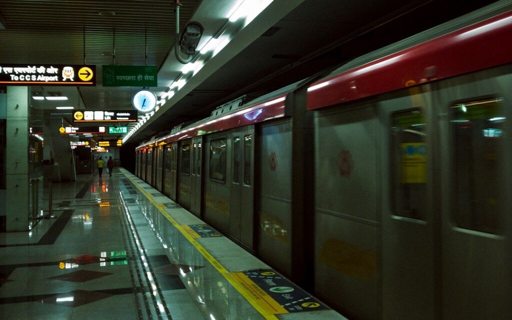 Metro train pulling into a station platform