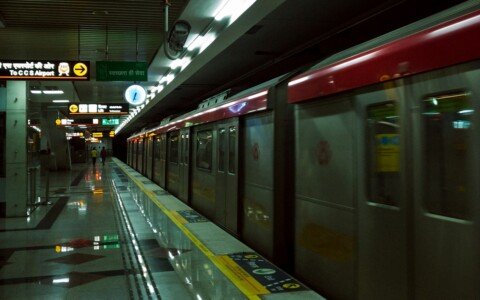 Metro train pulling into a station platform