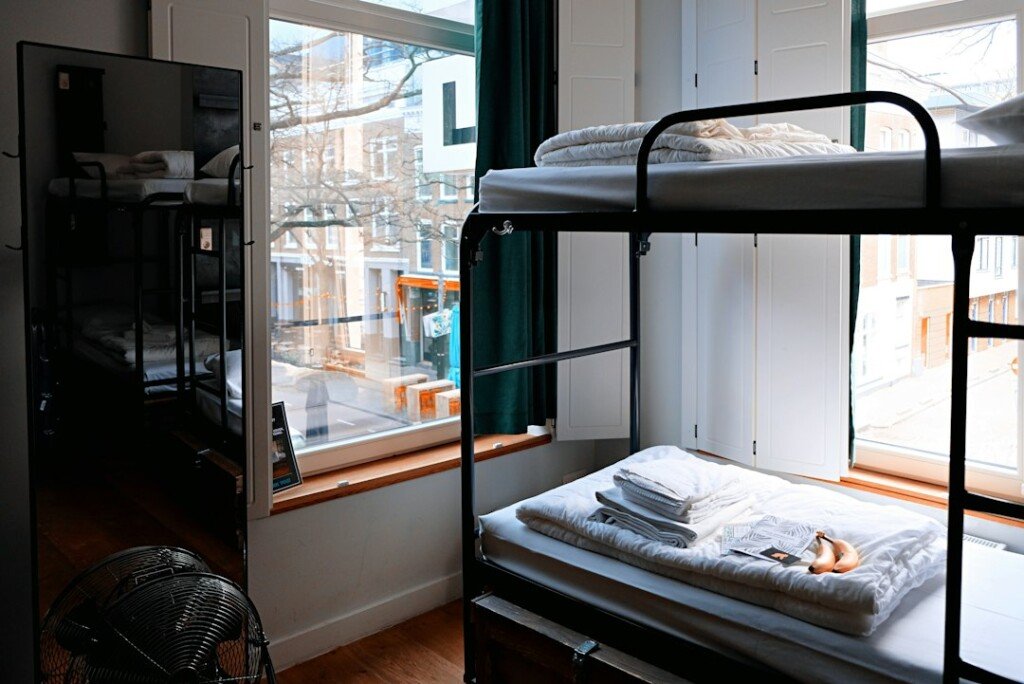 Shared student hostel room with bunk beds for outstation students