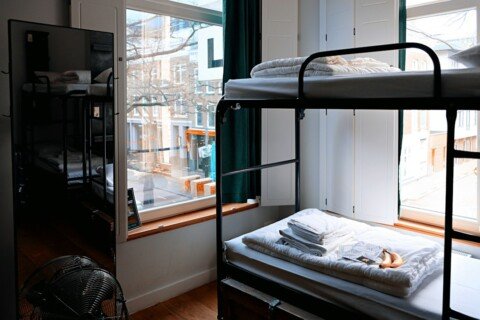 Shared student hostel room with bunk beds for outstation students